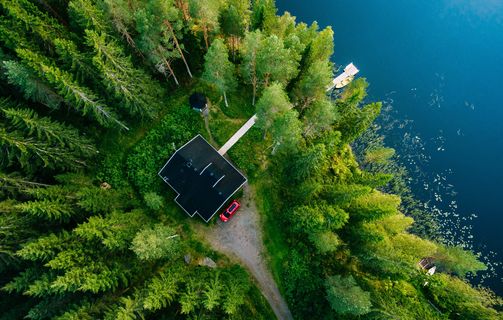 House in forest at lake